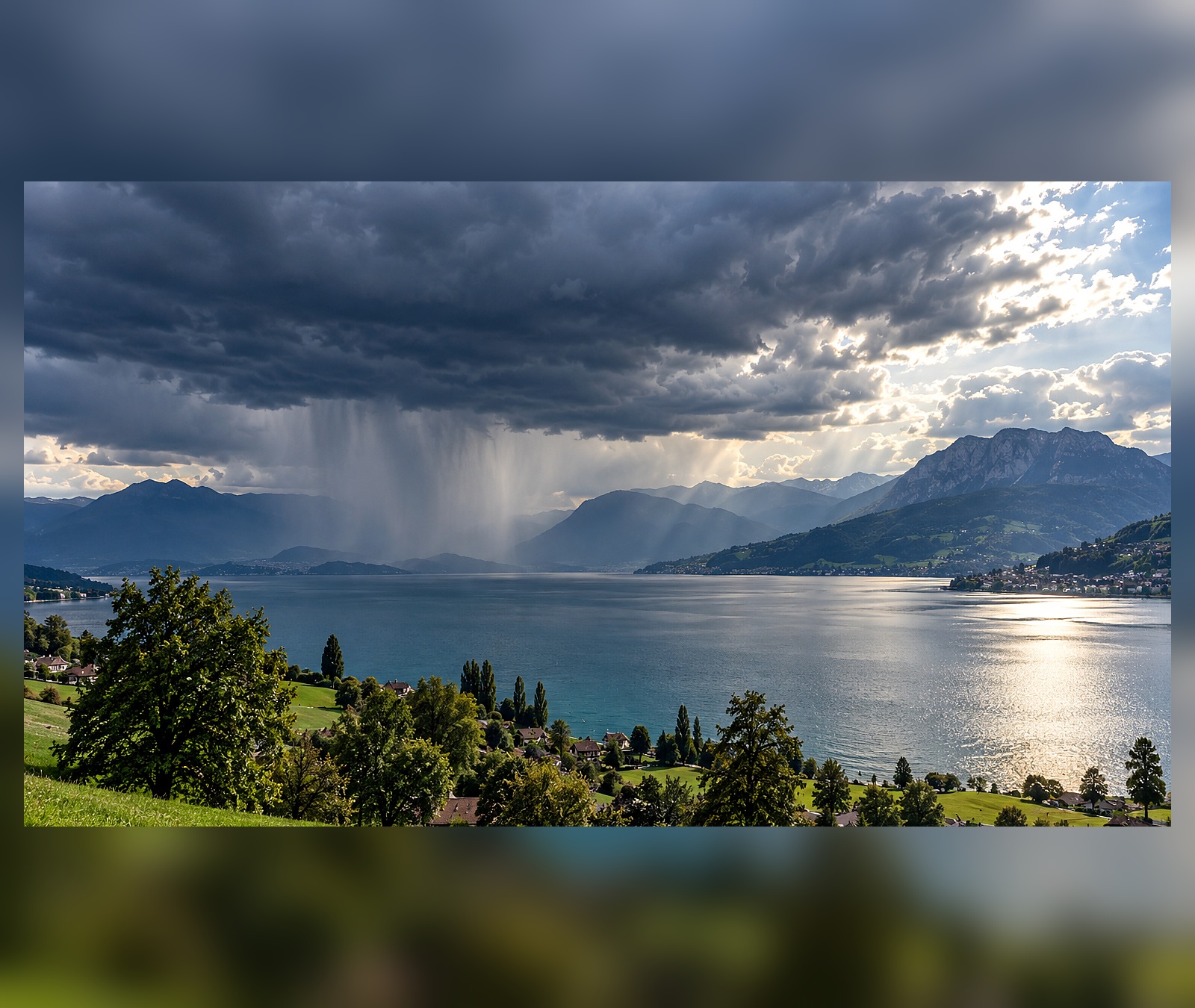 Dramatic frontal cloud band and rain curtains over a broad landscape