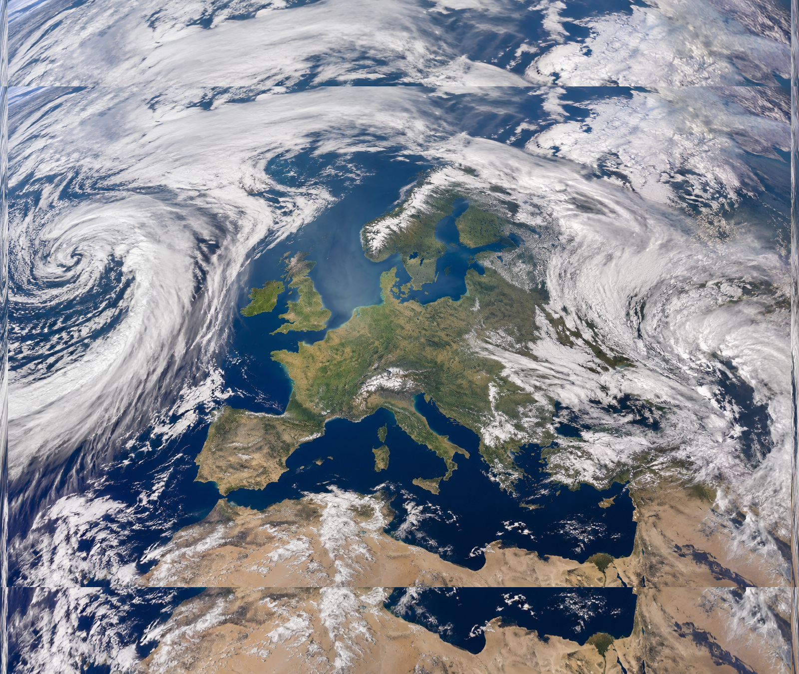 Satellite-style view of Europe between large Atlantic and eastern cloud systems