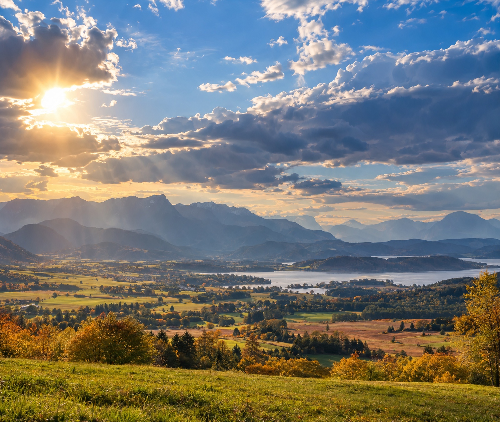 Warm late-September European landscape beneath a changing cloud field