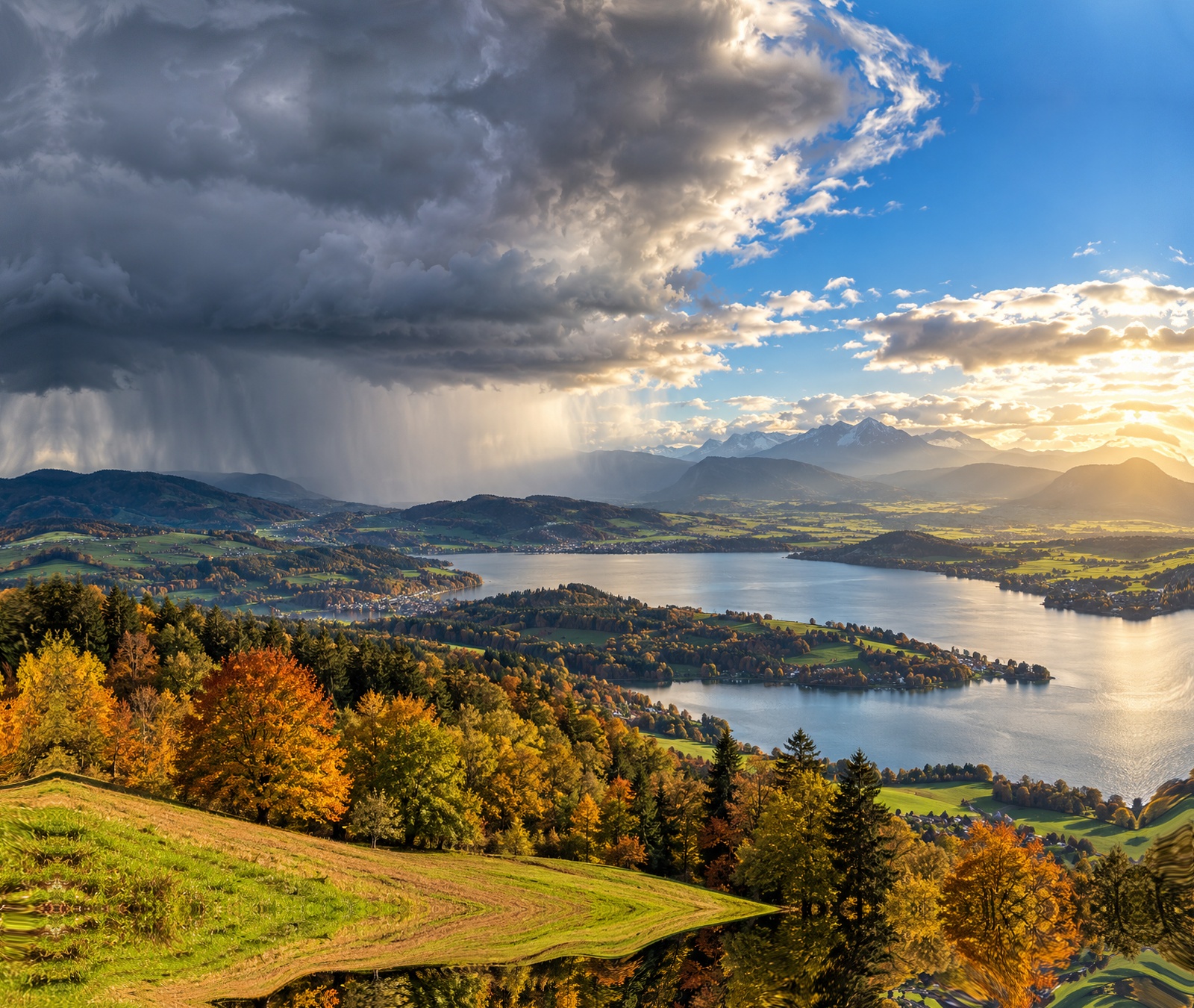 European autumn landscape with rain clouds to the west and sunshine farther east
